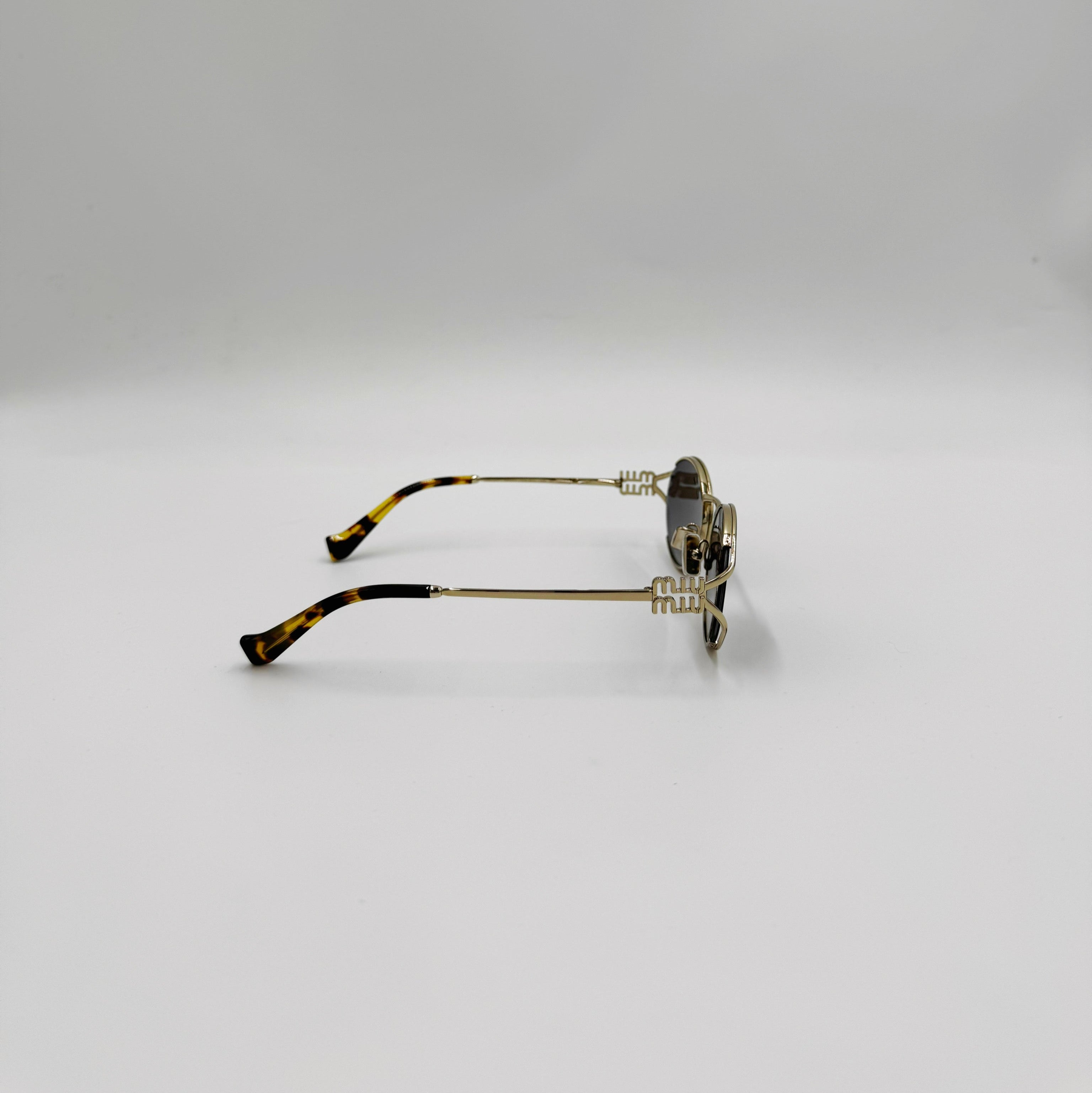 MiuMiu SMU52Y guld/gråt glas