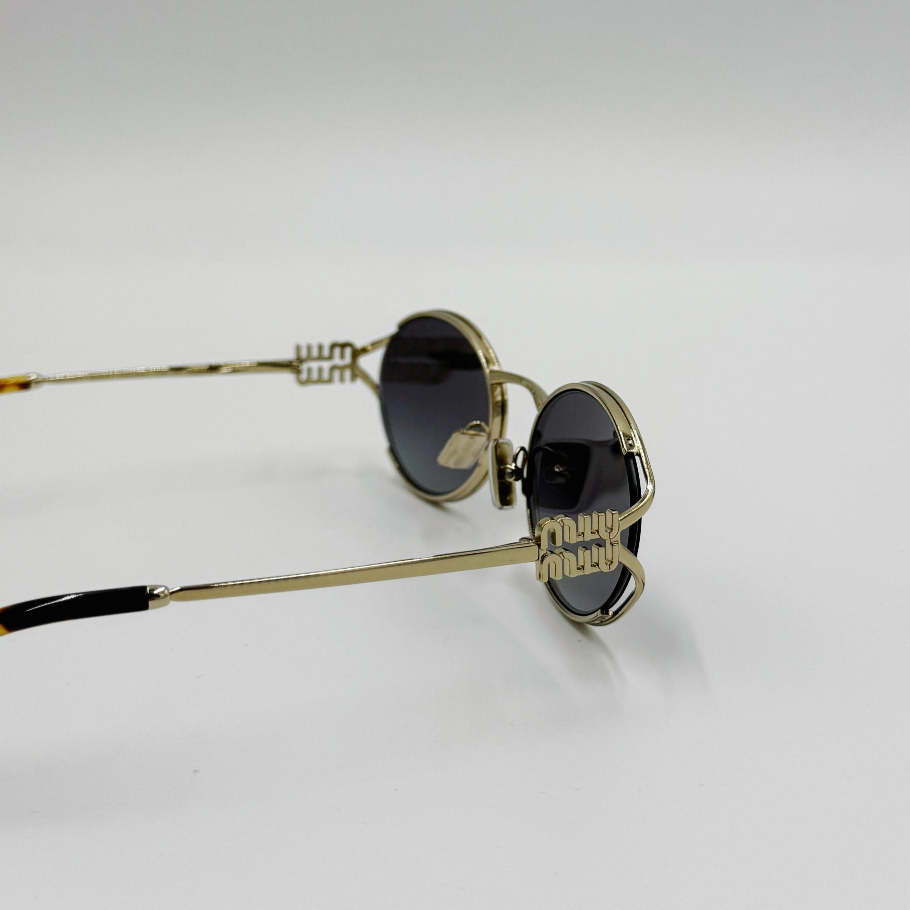 MiuMiu SMU52Y guld/gråt glas