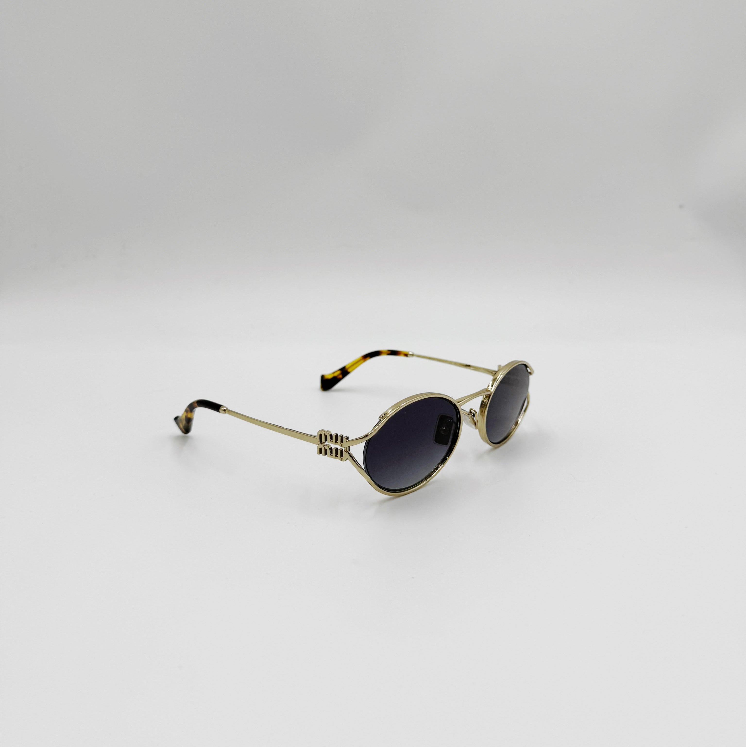 MiuMiu SMU52Y guld/gråt glas